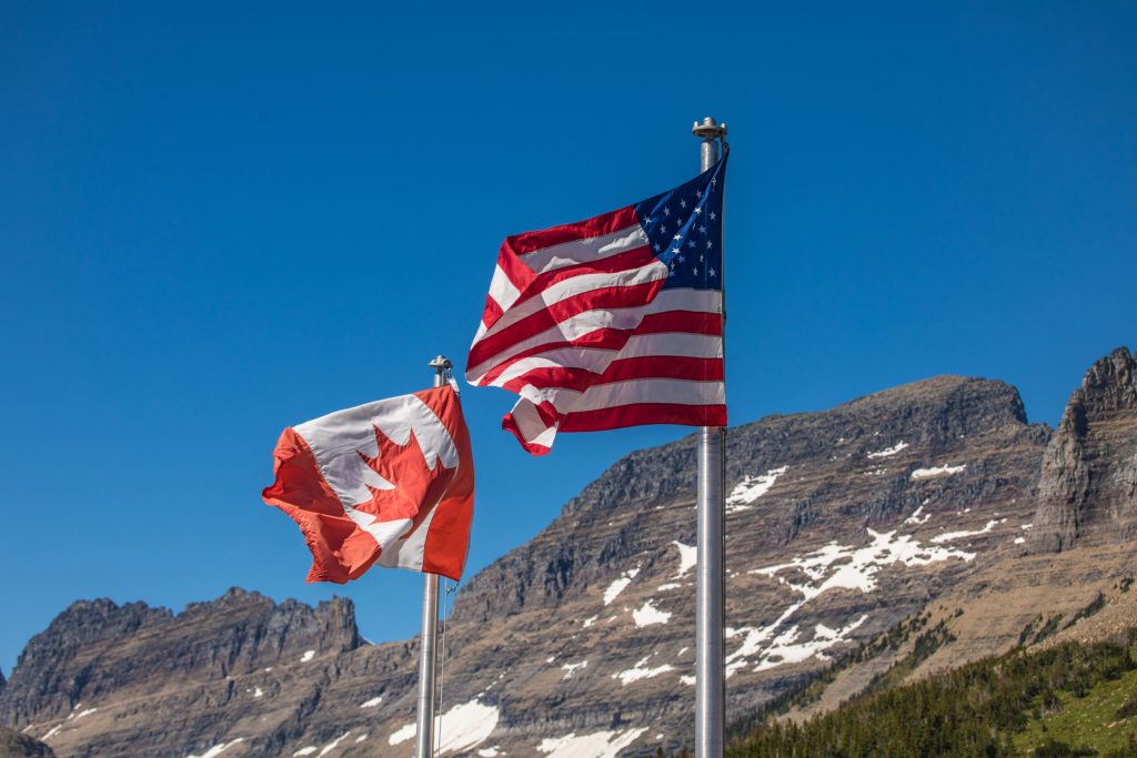 The US flag and Canadian flag.